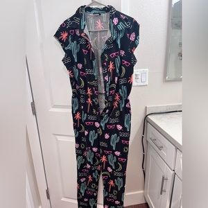 Retrolicious cute summery jumpsuit. Black with pockets, buttons, and neon